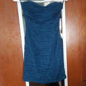 Teal ruched bodycon mini dress.